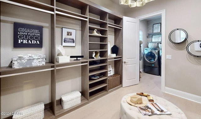 spacious closet with washer and dryer