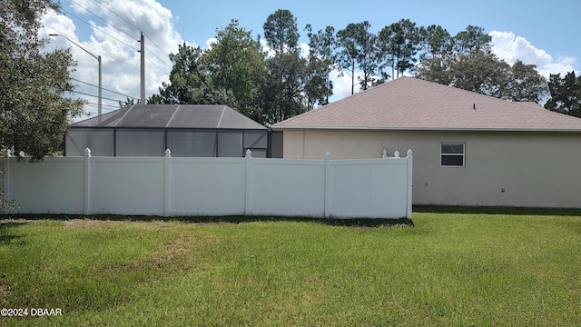 view of yard featuring a lanai