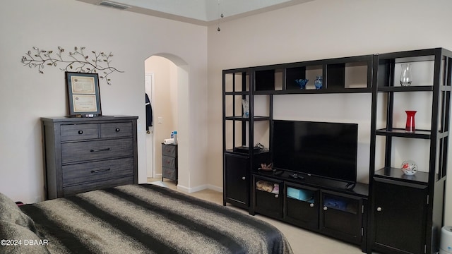 bedroom featuring light carpet