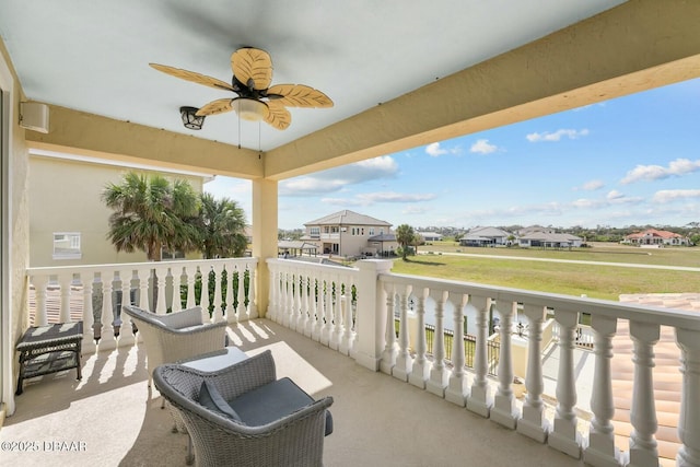 balcony with ceiling fan and a porch