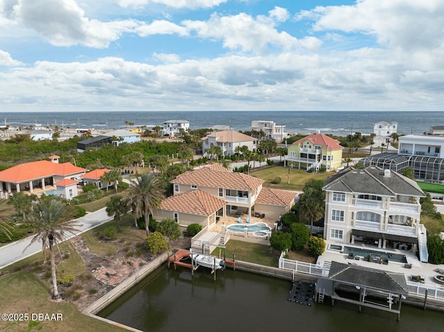 birds eye view of property featuring a water view