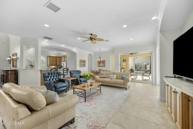 living room featuring crown molding and ceiling fan