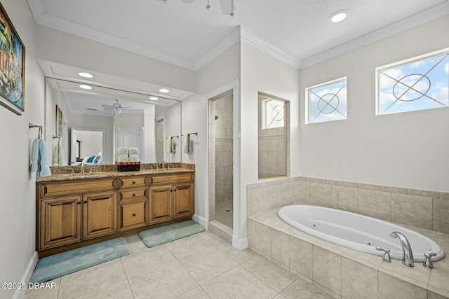 bathroom featuring ornamental molding, vanity, shower with separate bathtub, and tile patterned flooring