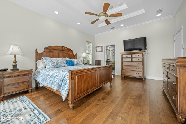 bedroom featuring crown molding, hardwood / wood-style floors, and ceiling fan