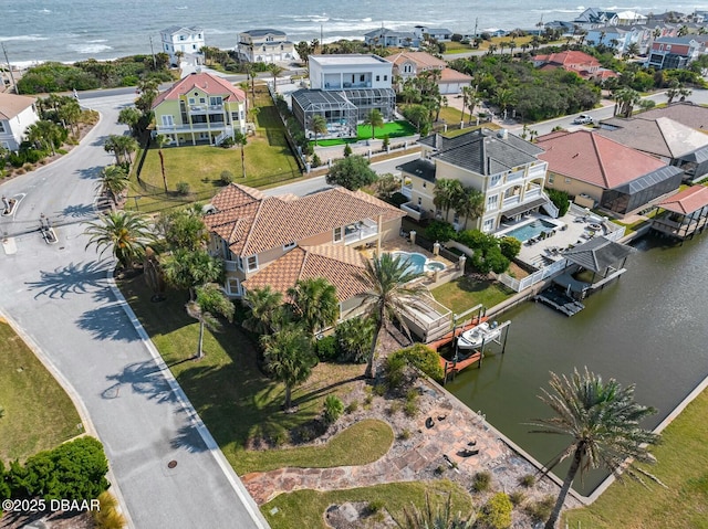 drone / aerial view with a water view