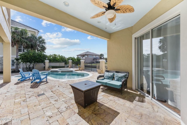 view of pool featuring an in ground hot tub, ceiling fan, an outdoor living space, and a patio area