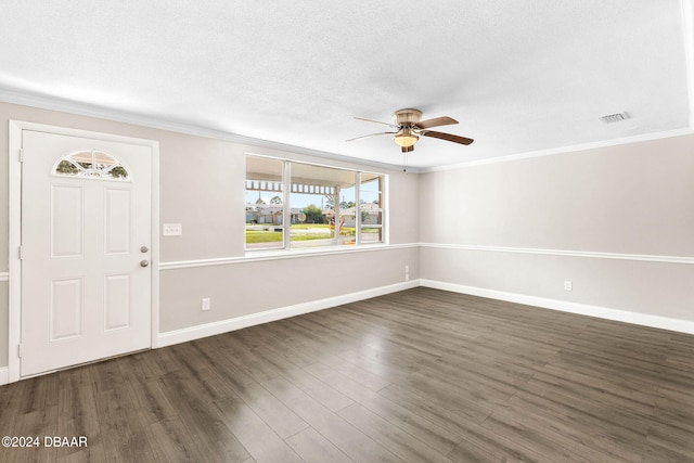 foyer with dark hardwood / wood-style floors, ceiling fan, ornamental molding, and a textured ceiling