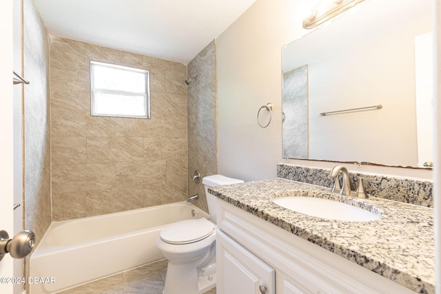 full bathroom with tile patterned floors, tiled shower / bath combo, toilet, and vanity