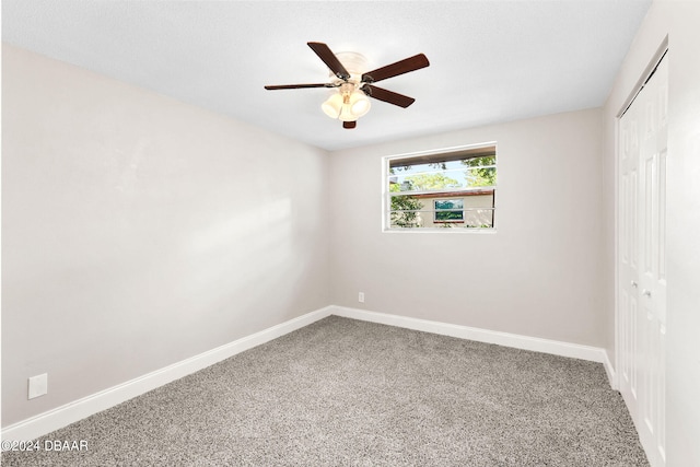 carpeted empty room with ceiling fan