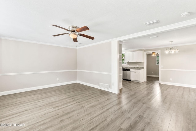 unfurnished living room featuring a textured ceiling, ceiling fan with notable chandelier, light hardwood / wood-style flooring, and crown molding