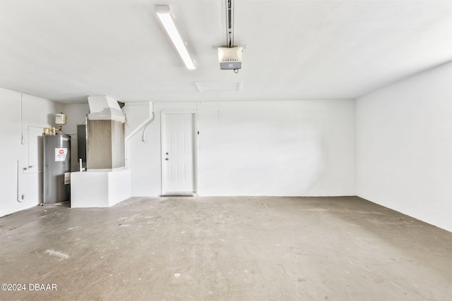 garage featuring a garage door opener and water heater