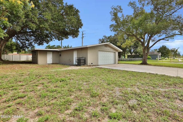 view of front of property with a garage and a front yard