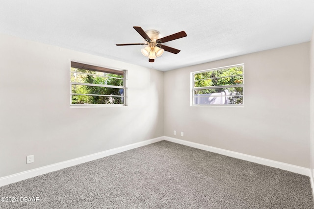 carpeted empty room with ceiling fan