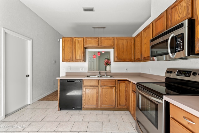 3864 Long Grove Ln, Port Orange, FL 32129 - kitchen featuring light tile patterned floors, sink, and appliances with stainless steel finishes