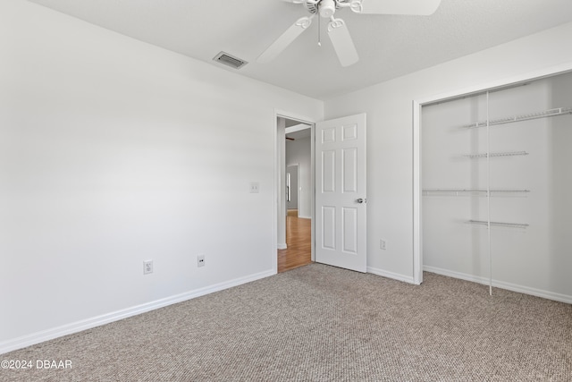 3864 Long Grove Ln, Port Orange, FL 32129 - unfurnished bedroom with a closet, carpet, and ceiling fan