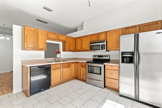 3864 Long Grove Ln, Port Orange, FL 32129 - kitchen with light hardwood / wood-style floors, sink, appliances with stainless steel finishes, hanging light fixtures, and a notable chandelier