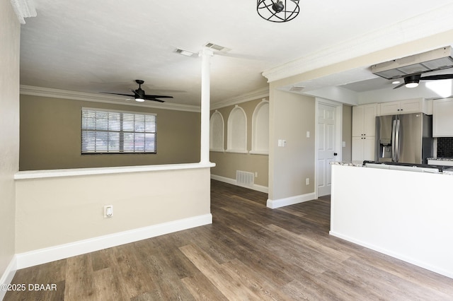 spare room with dark hardwood / wood-style floors, ceiling fan, and crown molding