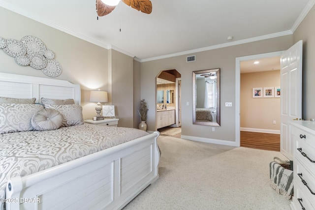 4672 Riverwalk Village Ct Unit 8203, Ponce Inlet, FL 32127 - bedroom featuring crown molding, light carpet, baseboards, ensuite bathroom, and visible vents