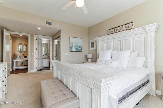4672 Riverwalk Village Ct Unit 8203, Ponce Inlet, FL 32127 - bedroom featuring baseboards, visible vents, light carpet, and ensuite bathroom