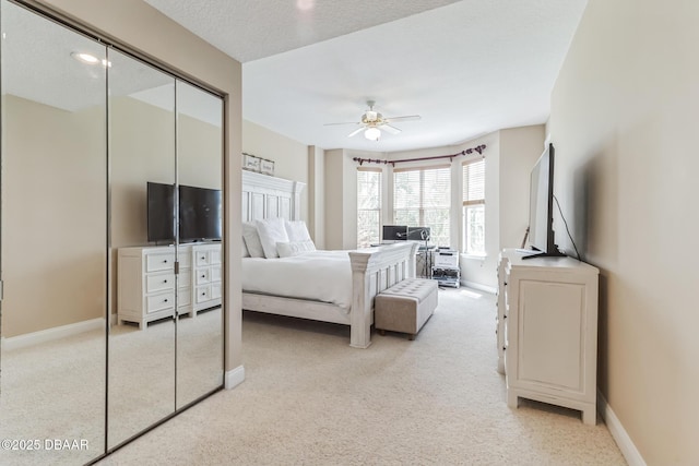 4672 Riverwalk Village Ct Unit 8203, Ponce Inlet, FL 32127 - bedroom featuring light colored carpet, baseboards, ceiling fan, and a closet