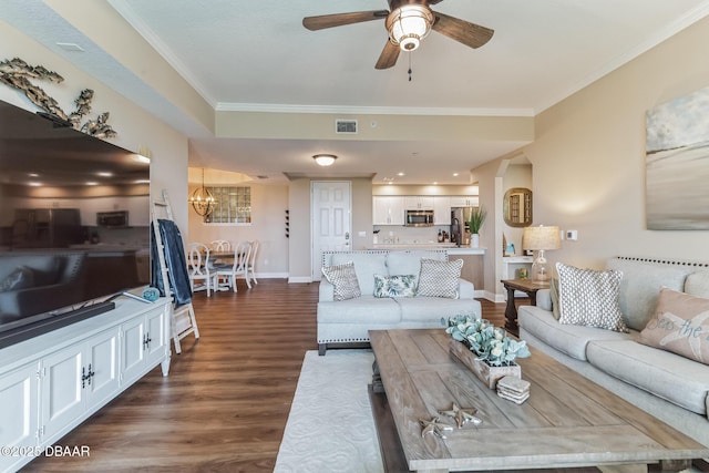 4672 Riverwalk Village Ct Unit 8203, Ponce Inlet, FL 32127 - living room with crown molding, ceiling fan with notable chandelier, baseboards, dark wood-type flooring, and visible vents