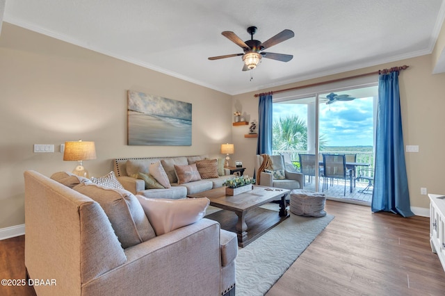 4672 Riverwalk Village Ct Unit 8203, Ponce Inlet, FL 32127 - living room with baseboards, ornamental molding, ceiling fan, and wood finished floors