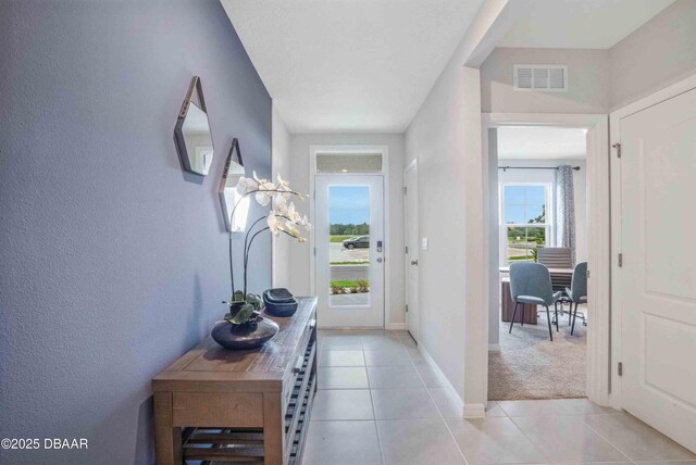 2705 Keene Ln, Deltona, FL 32725 - doorway to outside featuring light tile patterned flooring