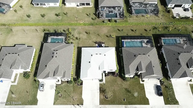 birds eye view of property with a residential view