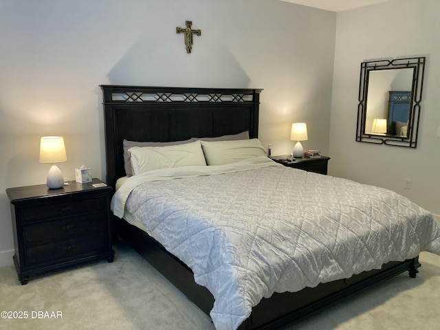 bedroom with light colored carpet