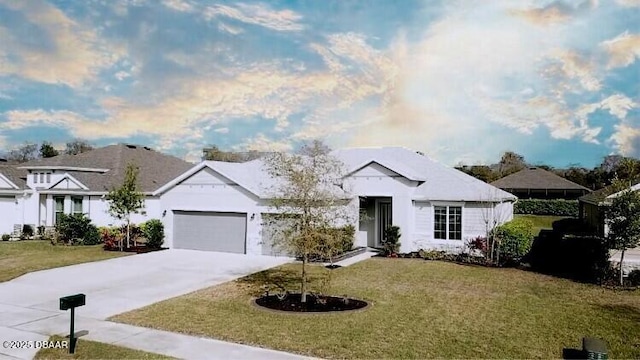 view of front facade with a garage, driveway, and a front yard