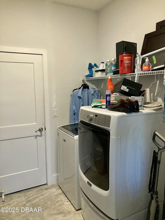 laundry area with laundry area and washer and clothes dryer