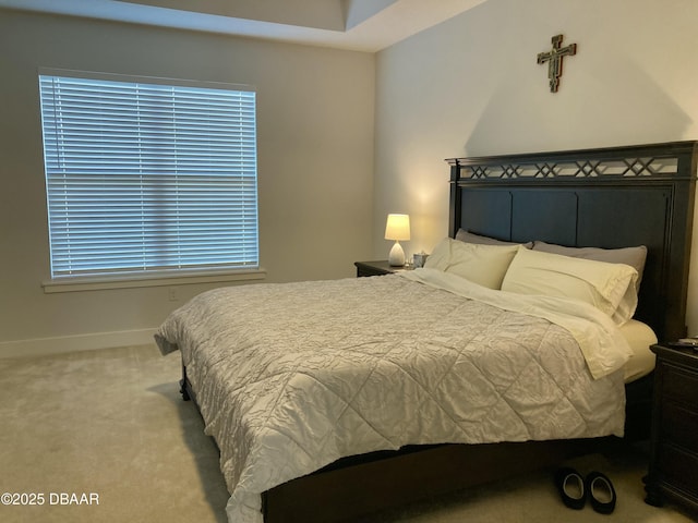 carpeted bedroom with baseboards