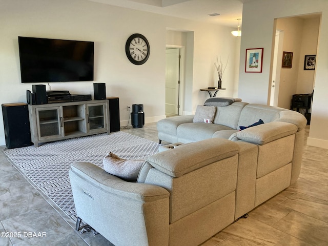 living room featuring baseboards