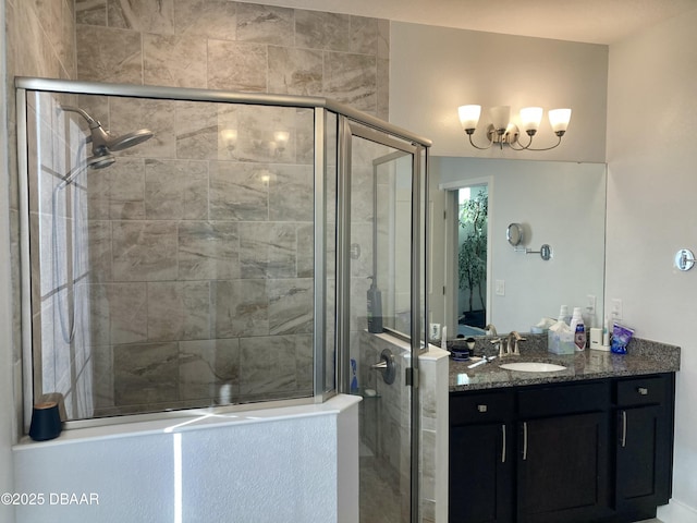 bathroom featuring a stall shower and vanity