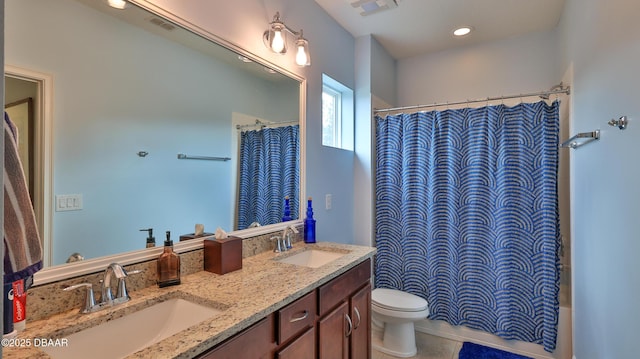 bathroom with visible vents, toilet, and a sink