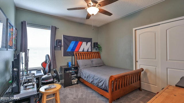 bedroom featuring a closet, multiple windows, carpet, and ceiling fan