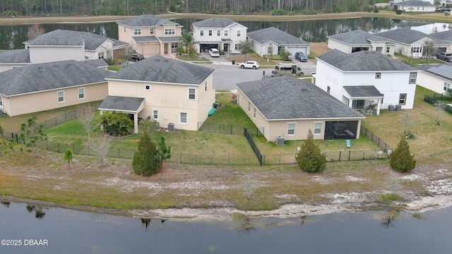 birds eye view of property featuring a residential view and a water view