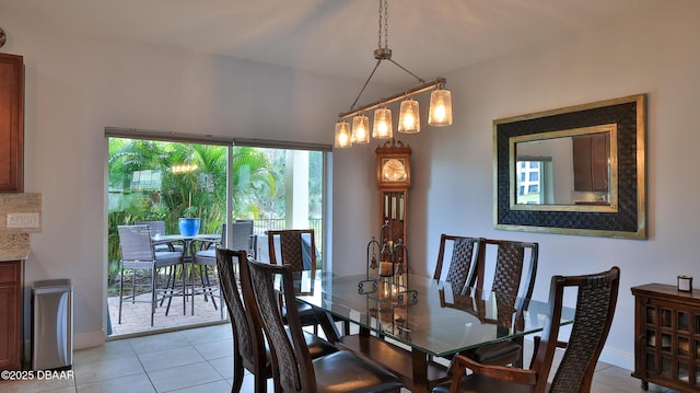 dining area with light tile patterned flooring and baseboards