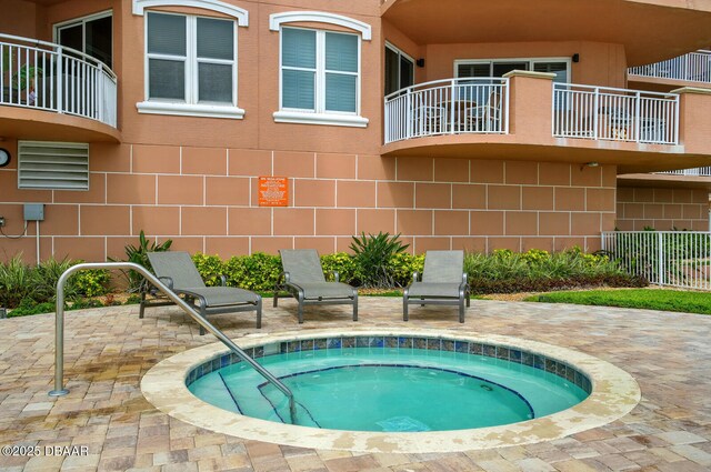 2515 S Atlantic Ave Unit 502, Daytona Beach, FL 32118 - view of pool with a community hot tub and a patio