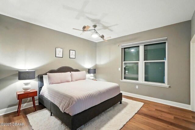 2515 S Atlantic Ave Unit 502, Daytona Beach, FL 32118 - bedroom featuring wood finished floors, baseboards, and a ceiling fan