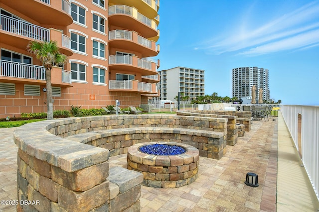 2515 S Atlantic Ave Unit 502, Daytona Beach, FL 32118 - view of patio / terrace featuring a fire pit