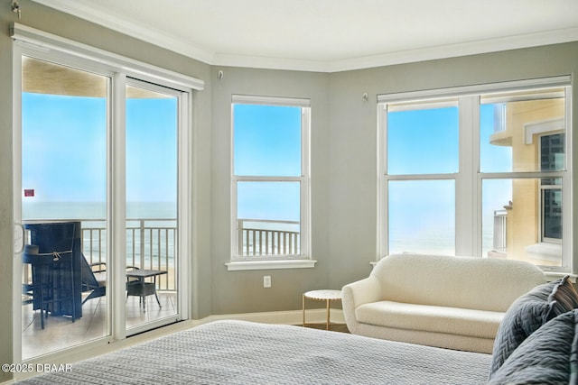 2515 S Atlantic Ave Unit 502, Daytona Beach, FL 32118 - bedroom with a water view, multiple windows, ornamental molding, baseboards, and access to outside