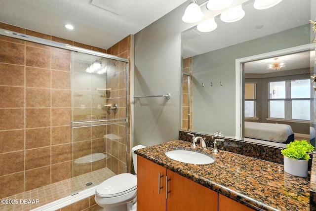 2515 S Atlantic Ave Unit 502, Daytona Beach, FL 32118 - ensuite bathroom with vanity, a stall shower, and toilet