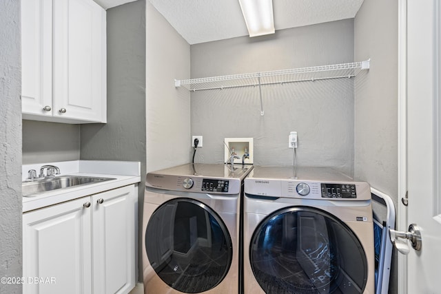 2515 S Atlantic Ave Unit 502, Daytona Beach, FL 32118 - laundry area featuring washer and dryer, cabinet space, and a textured wall