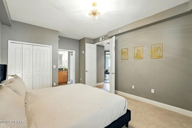 2515 S Atlantic Ave Unit 502, Daytona Beach, FL 32118 - bedroom with a closet, light colored carpet, and baseboards
