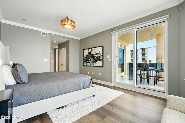 2515 S Atlantic Ave Unit 502, Daytona Beach, FL 32118 - bedroom with crown molding, wood finished floors, access to outside, baseboards, and recessed lighting
