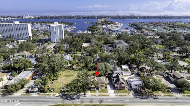 birds eye view of property with a water view