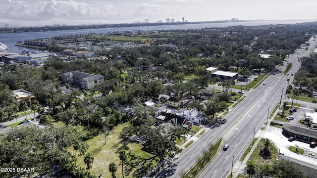 birds eye view of property with a city view and a water view