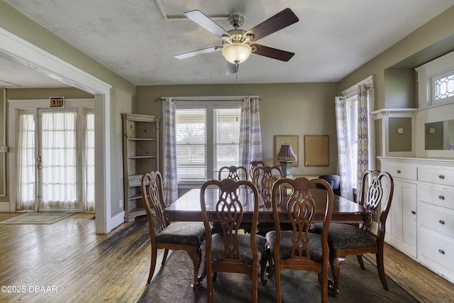 dining area featuring a ceiling fan and wood finished floors