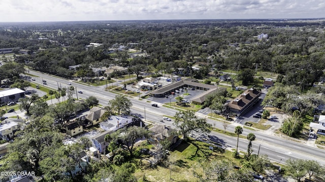 bird's eye view featuring a wooded view